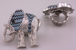Designer Inspired Rhodium Casting Stretchable Elephant Ring with Clear Crystals, Neon Blue Epoxy, and Black Epoxy. Ring Is 1.7 Long and 1.7 Wide. Nickel and Lead Compliant.